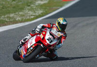 Troy Bayliss has great style, and the Ducati ever looks better than here, at Monza. No change externally to last year - it's a red Ducati after all...