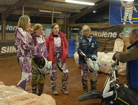 Nerves showing slightly, perhaps, the ladies are introduced to the dirt...and the bike...