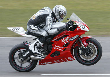 Calvin conscientiously tries to save Yamaha a few pound on front tyre wear...