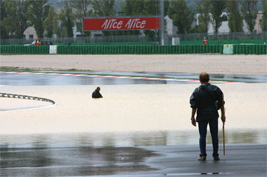 Look to the left. See the armco? That's 3 layers high - the bloke really is in it up to his waist...