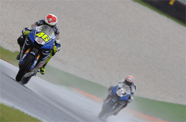 Ah, that good old Tuscan sunshine... Colin Edwards looks for the wiper switch on his Yamaha as he follows Rossi down a sodden Mugello straight...