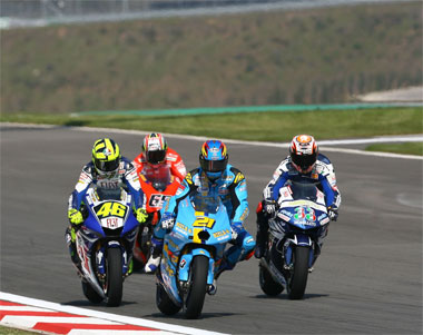 Not what we normally expect to see - Rosis gets mugged by Hopkins and Melandri, while Capirossi waits to pick up the pieces...