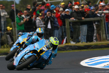 Vermeulen and Capirossi indulge in some formation flying...