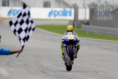 Valentino Rossi, king of the world. Again. Still, gives him time to practice his wheelies, right?