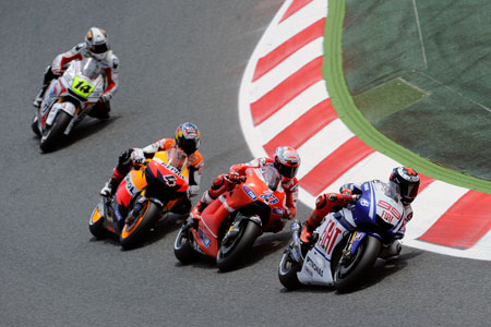 Lorenzo leads Stoner and Dovizioso, with de Puniet waiting for one of them to get it wrong... (Pic: Yamaha)