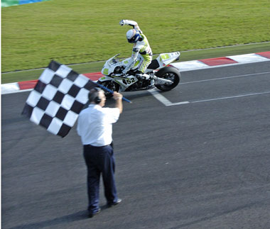 The moment of truth. He may not have won the race but, by a nail biting two points, he lifted the title... (Pic: Richard Handley)