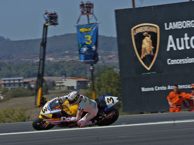 Max  Biaggi demonstrates his popularity by spontaneously growing banners out of his bike... (pic: Richard Handley)
