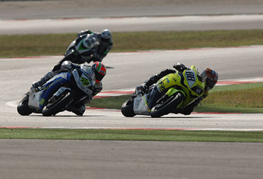 Shuhei Aoyama stuffs the Alto Evolution Honda under Roby Rolfo's similar bike in the best race of the team's season.
