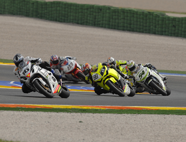 What could have been. Shuhei Aoyama leads Kenan Sofuoglu on the first lap after an astonishing start...