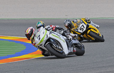 Carlos Checa gets past Troy Bayliss while Lorenzo Lanzi plays the waiting game...