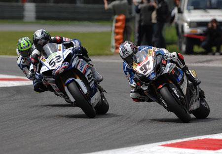 The Brits are coming! Haslam makes space for a smal bike and two thumpoing great big ones elbow through...