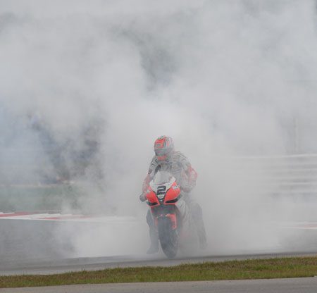 It seems traditional to have an Aprilia here this season, so here, for a change, is Leon Camier celebrating a couple of really strong rides...